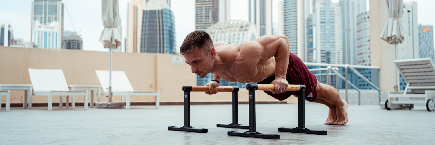 GORNATION athlete performs Push Up with Parallettes from GORNATION