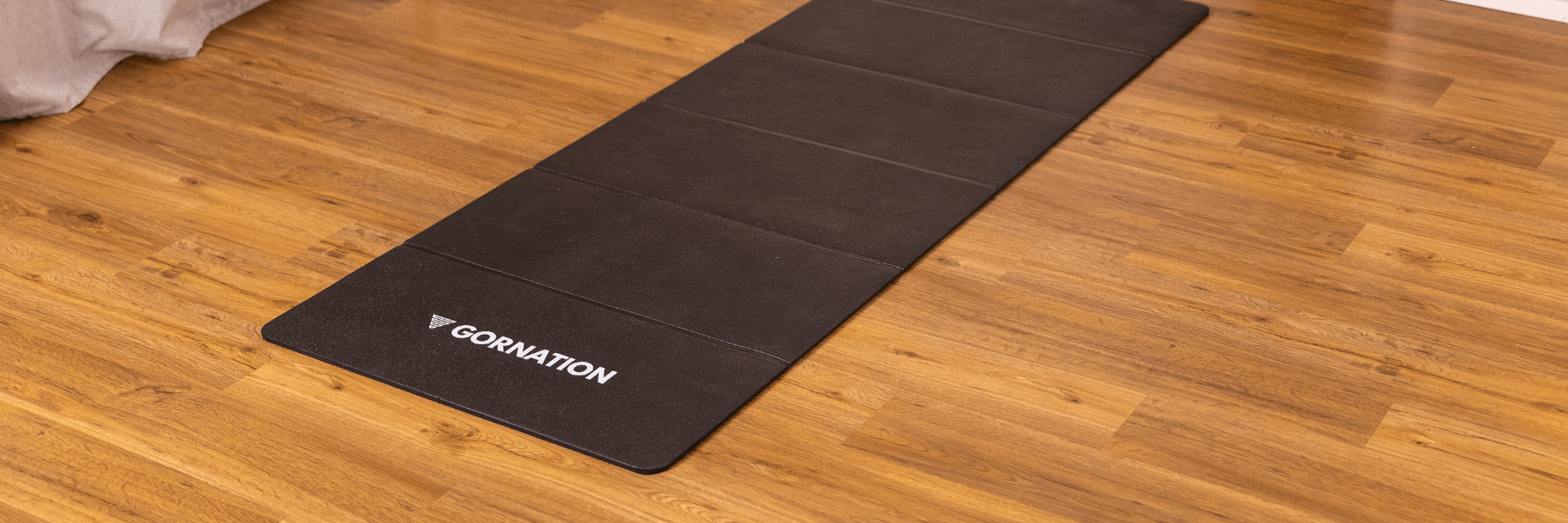 GORNATION Foldable Workout Mat laying in a living room