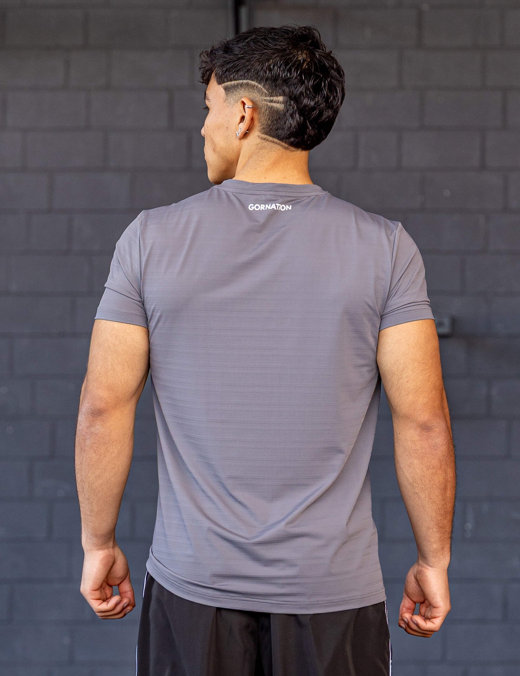 GORNATION athlete wearing the GORNATION active t-shirt in grey