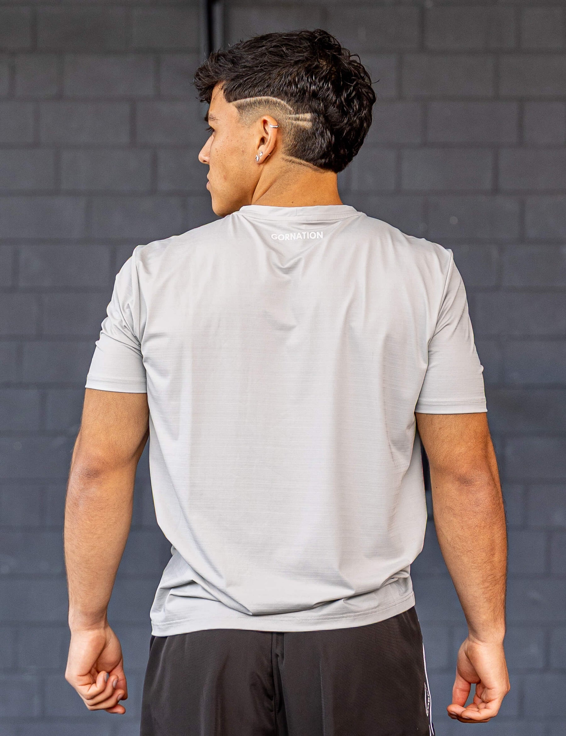 GORNATION athlete wearing the GORNATION active t-shirt in grey