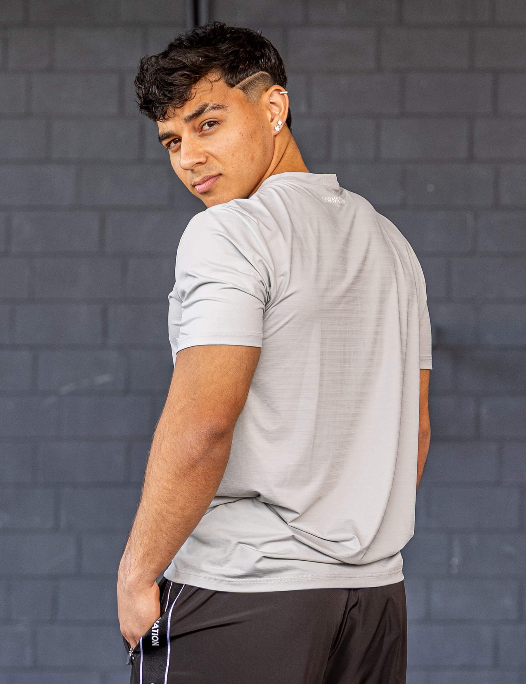 GORNATION athlete wearing the GORNATION active t-shirt in grey