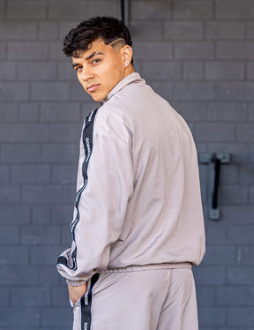 GORNATION athlete wearing the GORNATION tracksuite jacket in grey