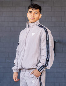 GORNATION athlete wearing the GORNATION tracksuite jacket in grey