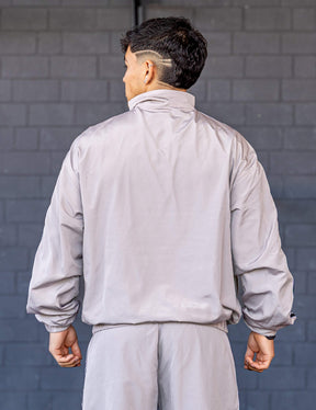 GORNATION athlete wearing the GORNATION tracksuite jacket in grey