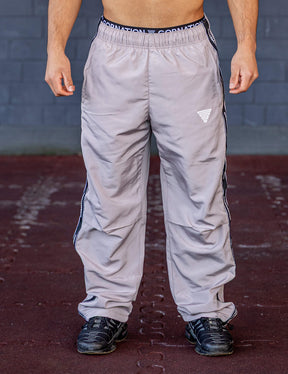 GORNATION athlete wearing the GORNATION tracksuite pants in grey