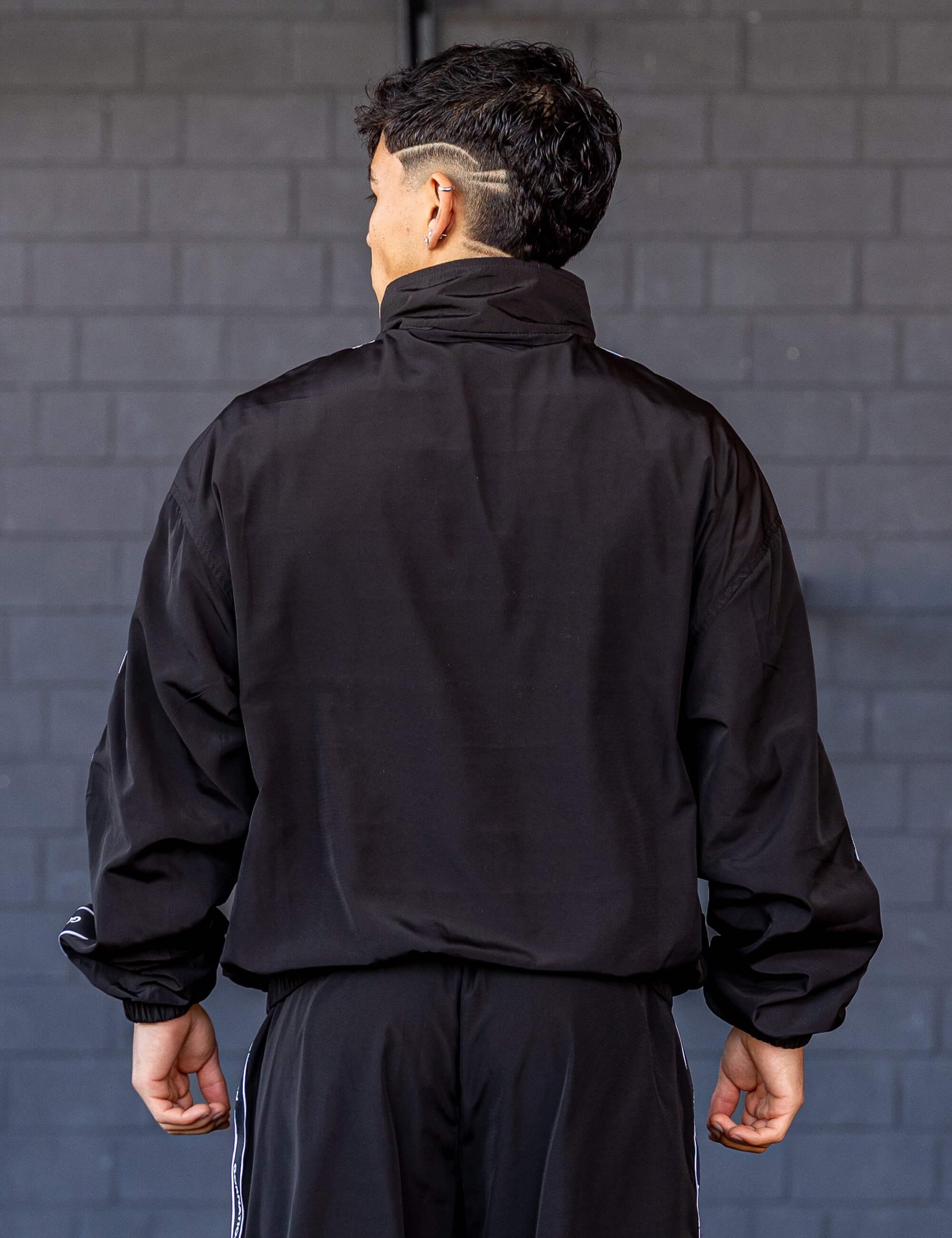 GORNATION athlete wearing the GORNATION tracksuite jacket in black