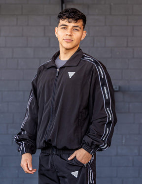 GORNATION athlete wearing the GORNATION tracksuite jacket in black