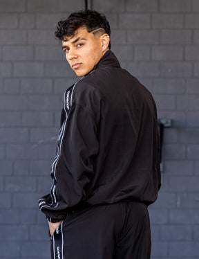 GORNATION athlete wearing the GORNATION tracksuite jacket in black
