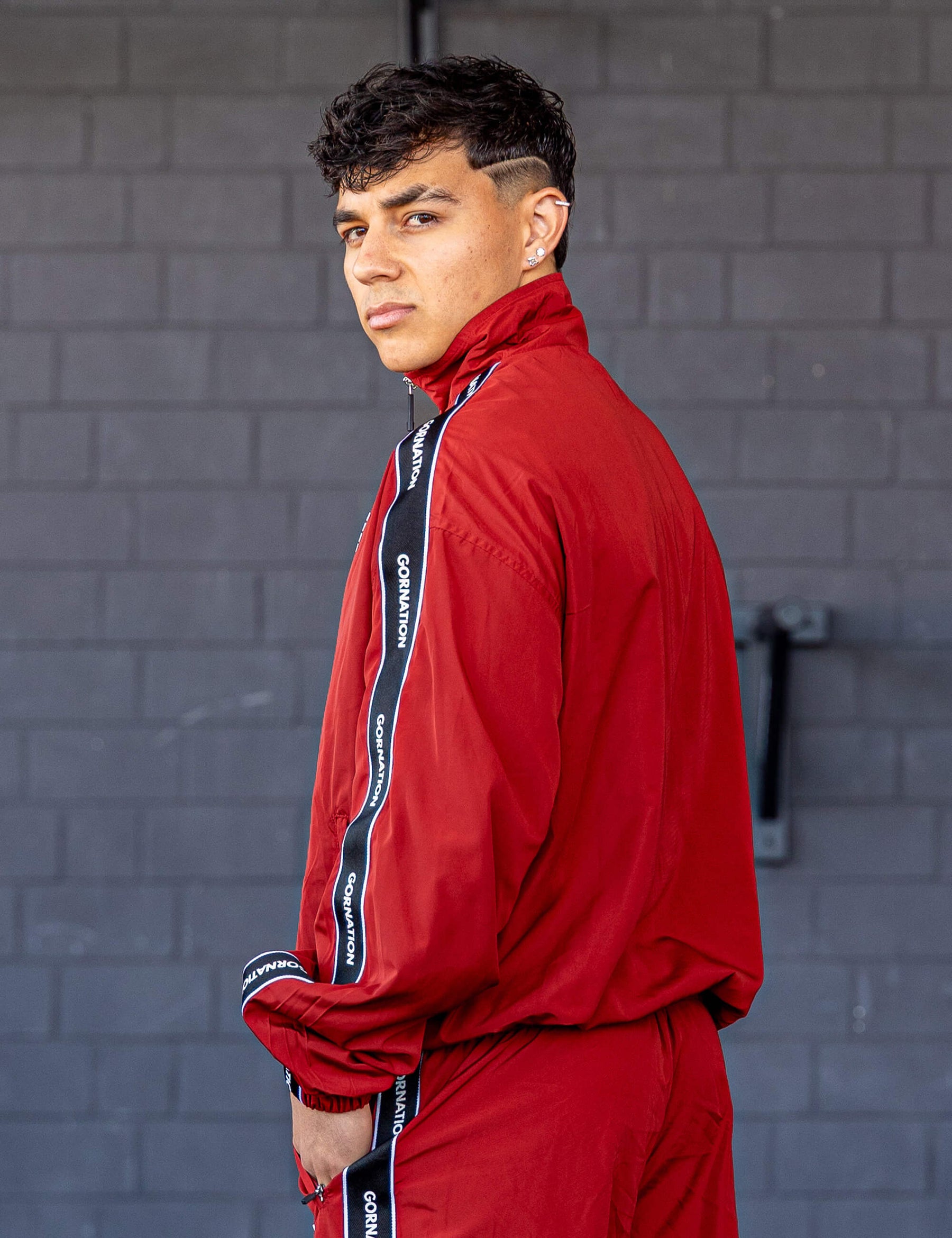 GORNATION athlete wearing the GORNATION tracksuite in red