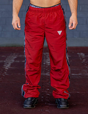 GORNATION athlete wearing the GORNATION tracksuite pants in red