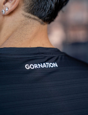 Close up of a GORNATION athlete wearing the GORNATION active t-shirt in black