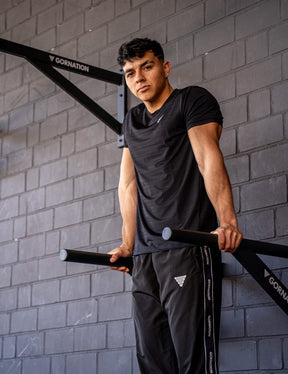 GORNATION athlete doing dips with GORNATION dip bars wearing an active t-shirt