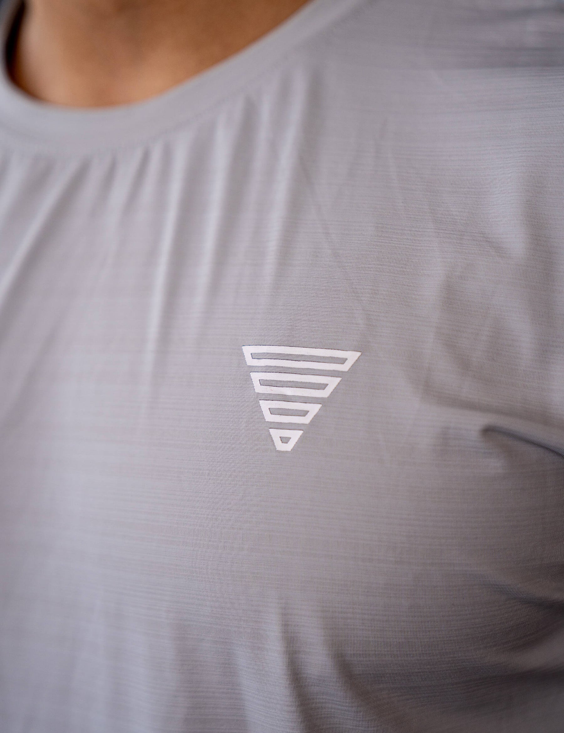 Close up of a GORNATION athlete wearing the GORNATION active t-shirt in grey