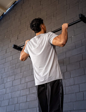 GORNATION athlete doing pull ups with a GORNATION pull up bar wearing an active t-shirt