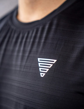 Close up of a GORNATION athlete wearing the GORNATION active tank top in black