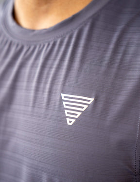 Close up of a GORNATION athlete wearing the GORNATION active tank top in grey