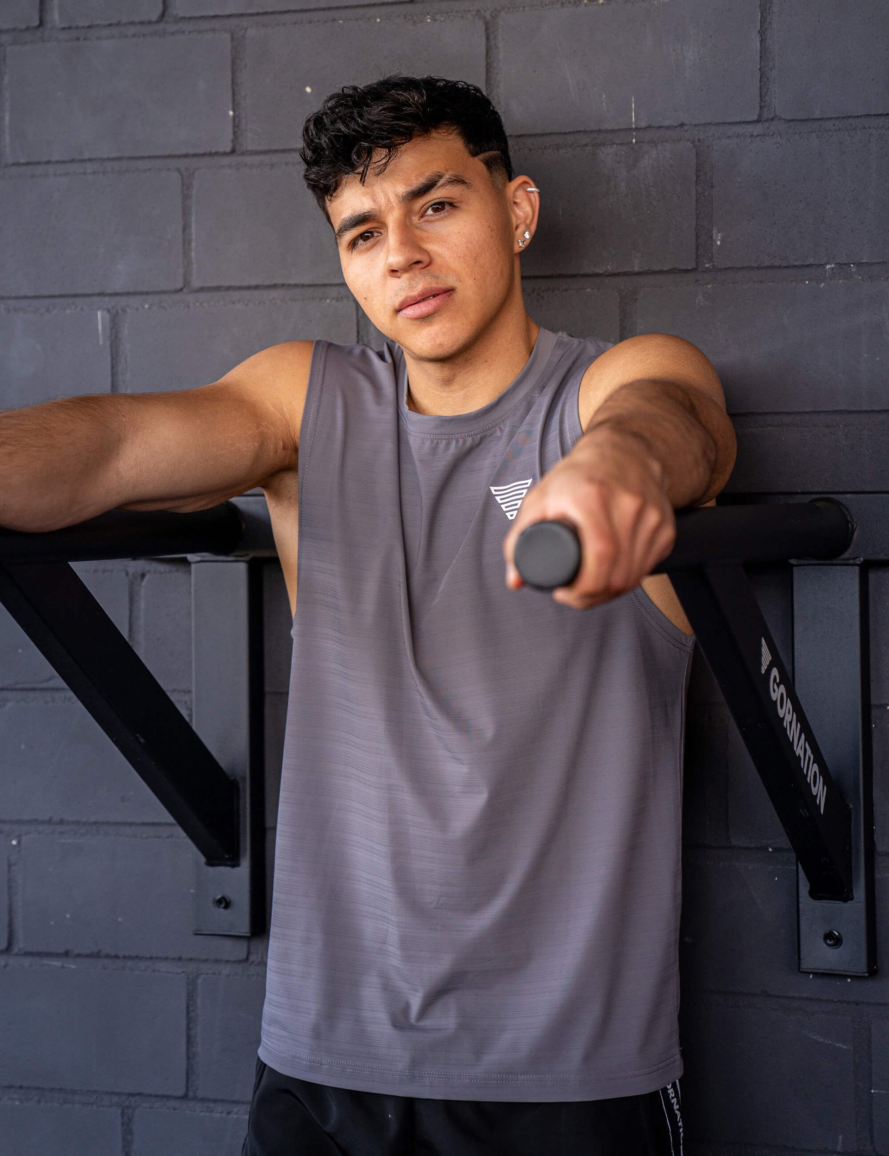 GORNATION athlete wearing the GORNATION active tank top in grey