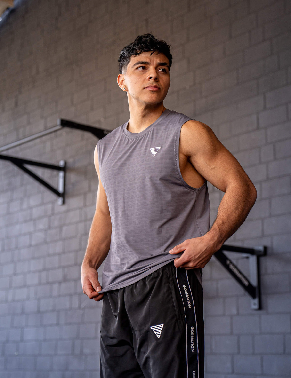 GORNATION athlete wearing the GORNATION active tank top in grey