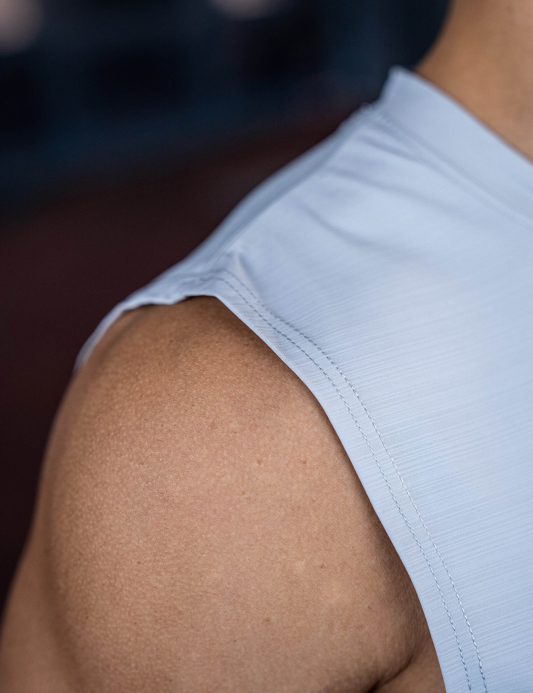 Close up of a GORNATION athlete wearing the GORNATION active tank top in grey