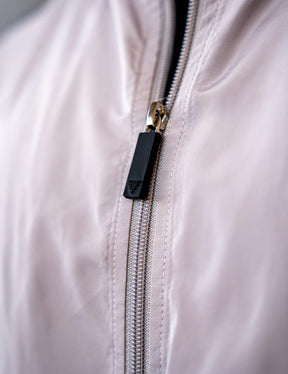 Close up of a GORNATION athlete wearing the GORNATION tracksuite jacket in grey