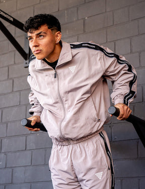 GORNATION athlete doing dips on GORNATION dip bars wearing a tracksuite