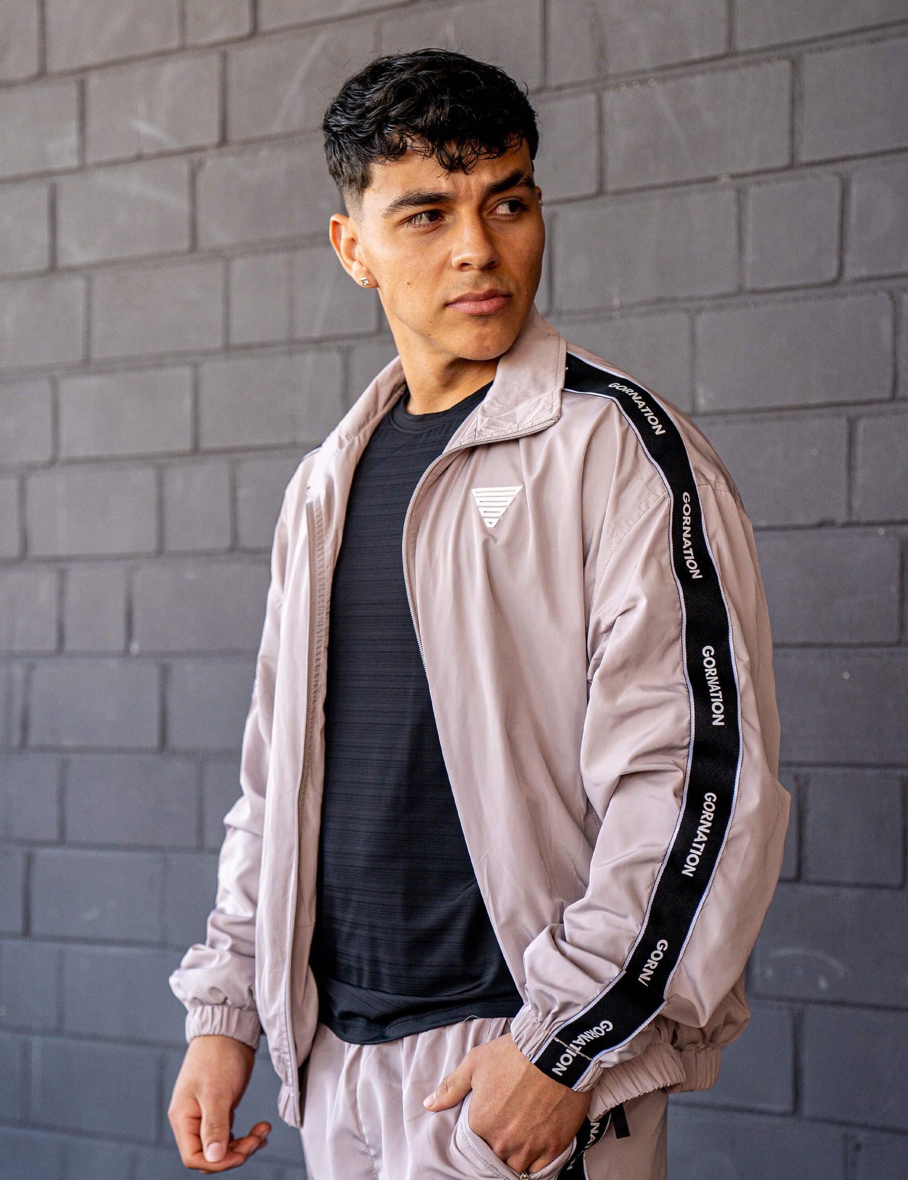 GORNATION athlete wearing the GORNATION tracksuite in grey