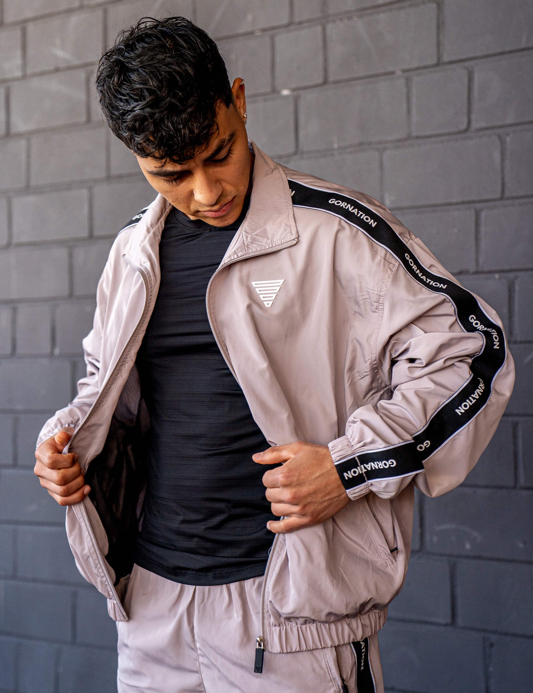 GORNATION athlete wearing the GORNATION tracksuite in grey