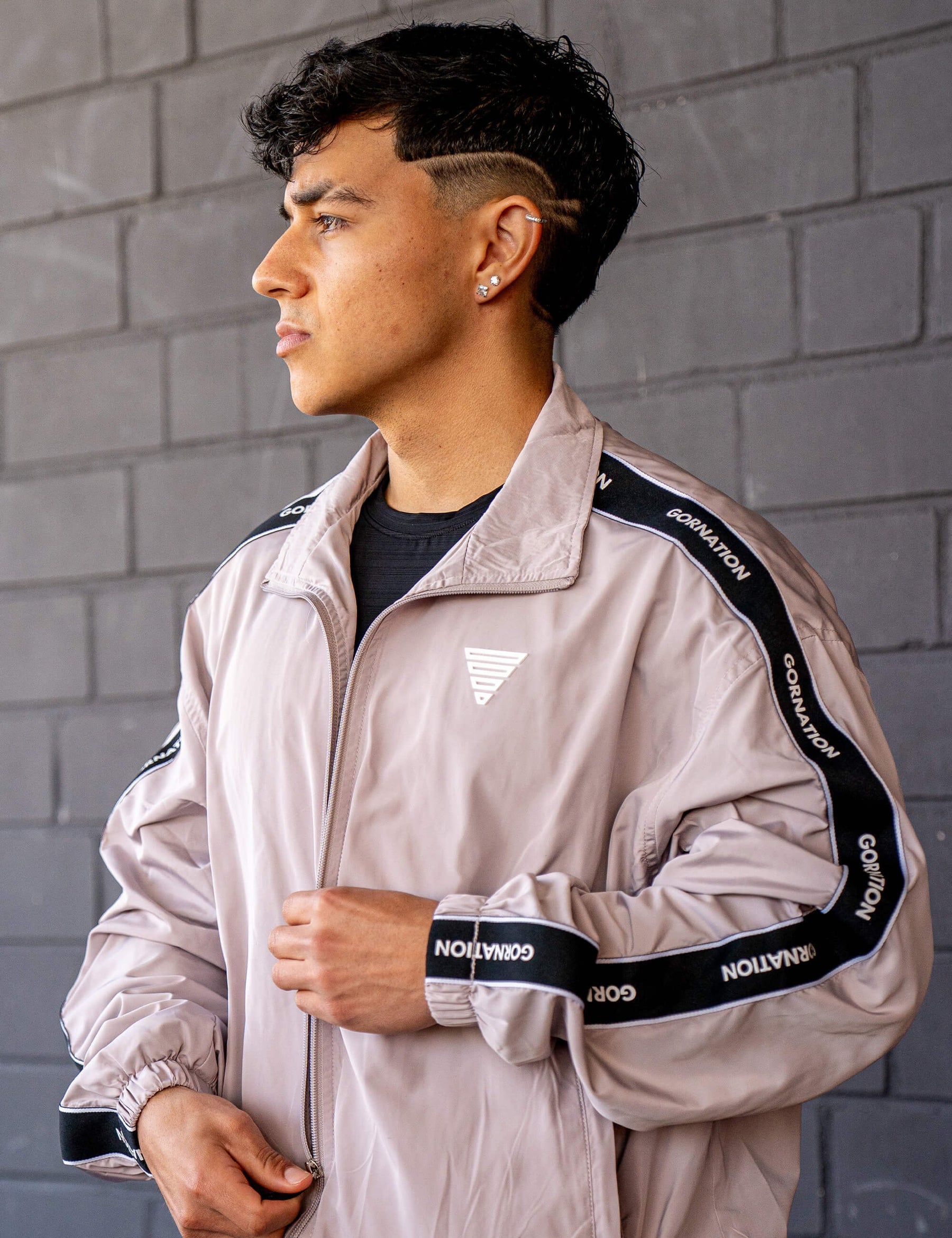 GORNATION athlete wearing the GORNATION tracksuite in grey