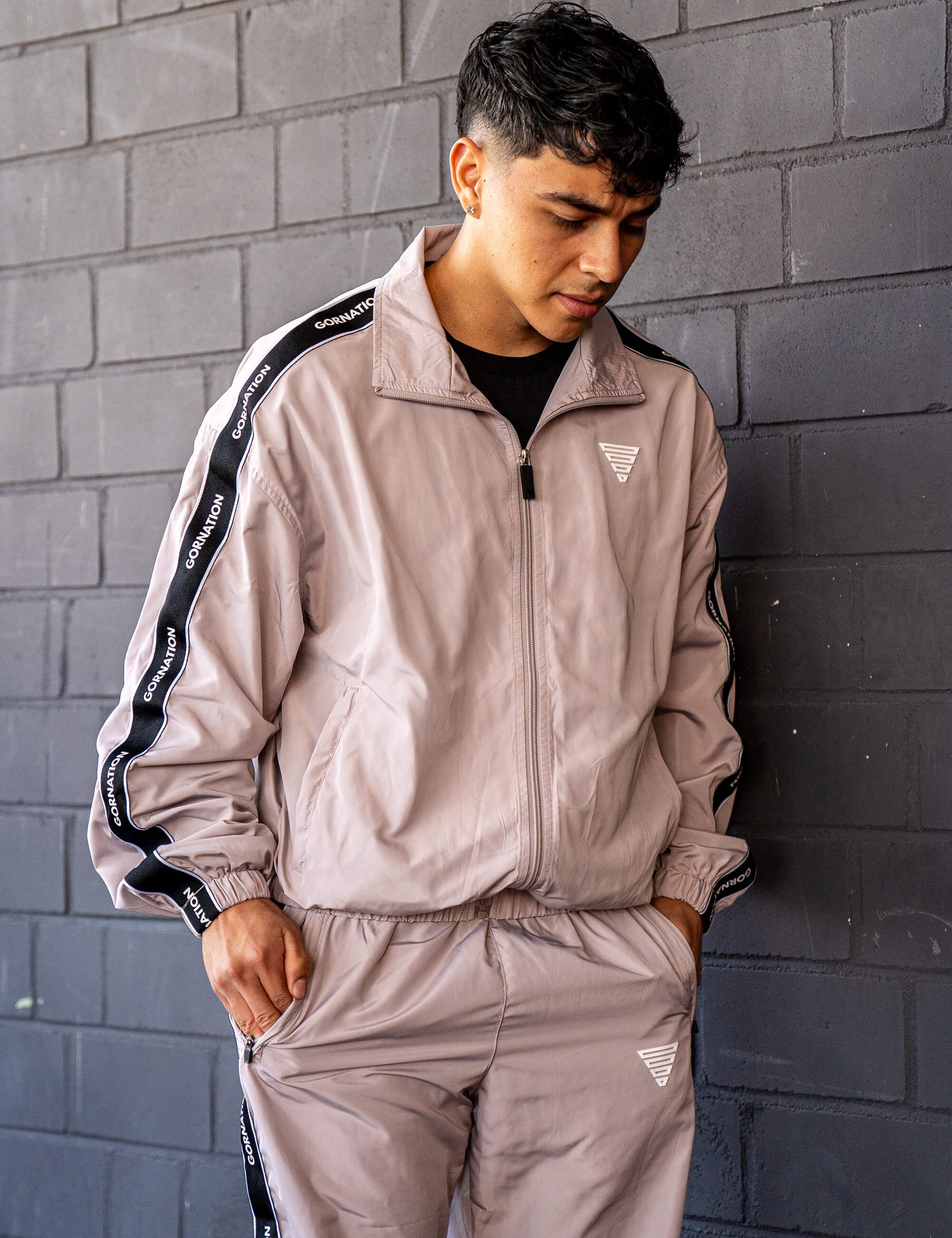 GORNATION athlete wearing the GORNATION tracksuite in grey