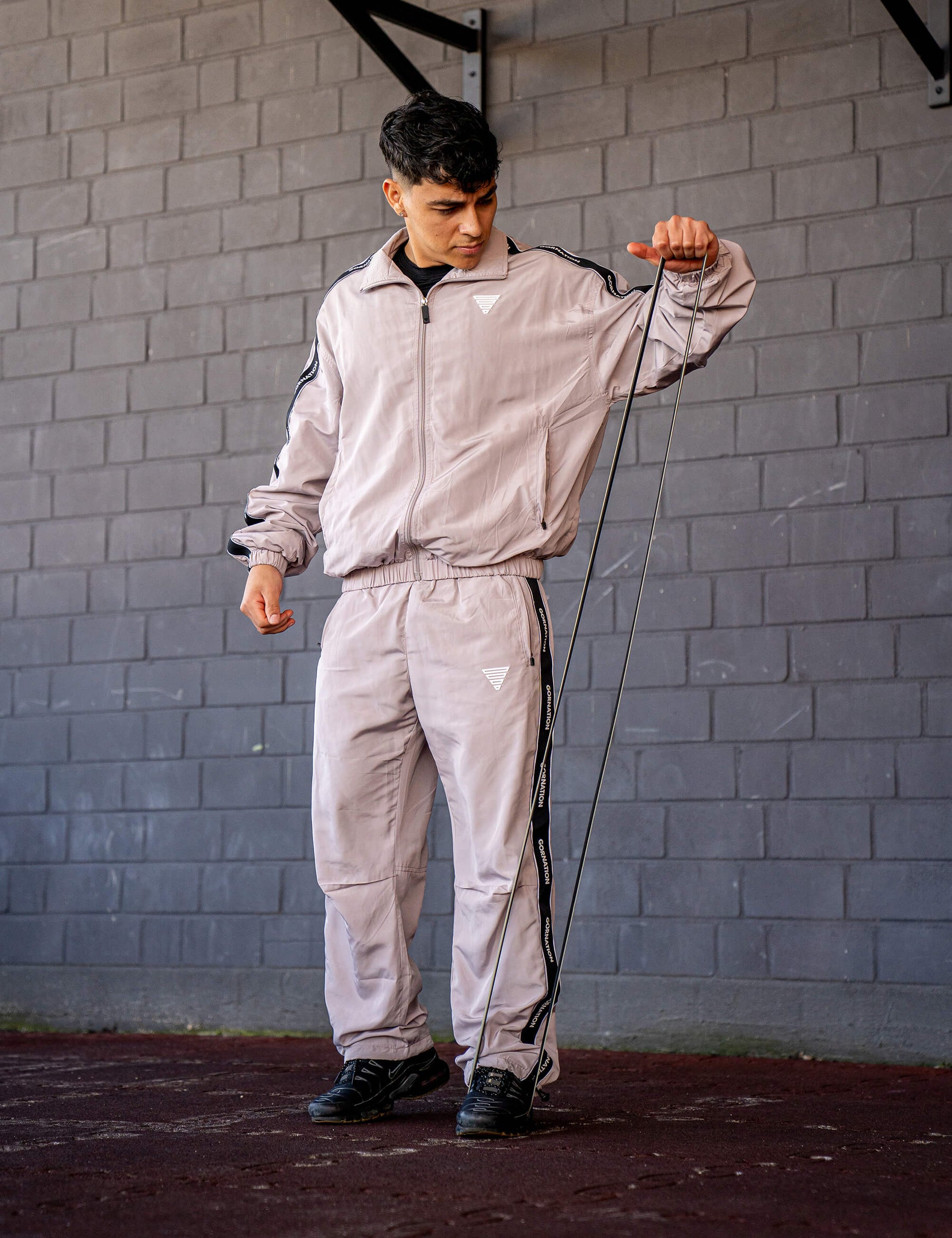 GORNATION athlete wearing the GORNATION tracksuite in grey