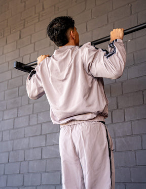 GORNATION athlete doing pull ups on a GORNATION pull up bar wearing a tracksuite