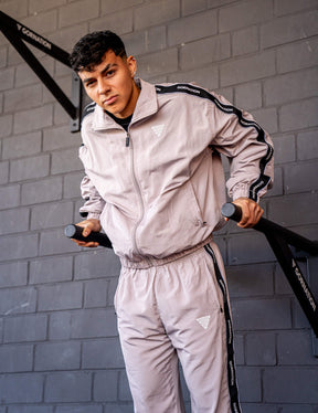 GORNATION athlete doing dips on GORNATION dip bars wearing a tracksuite