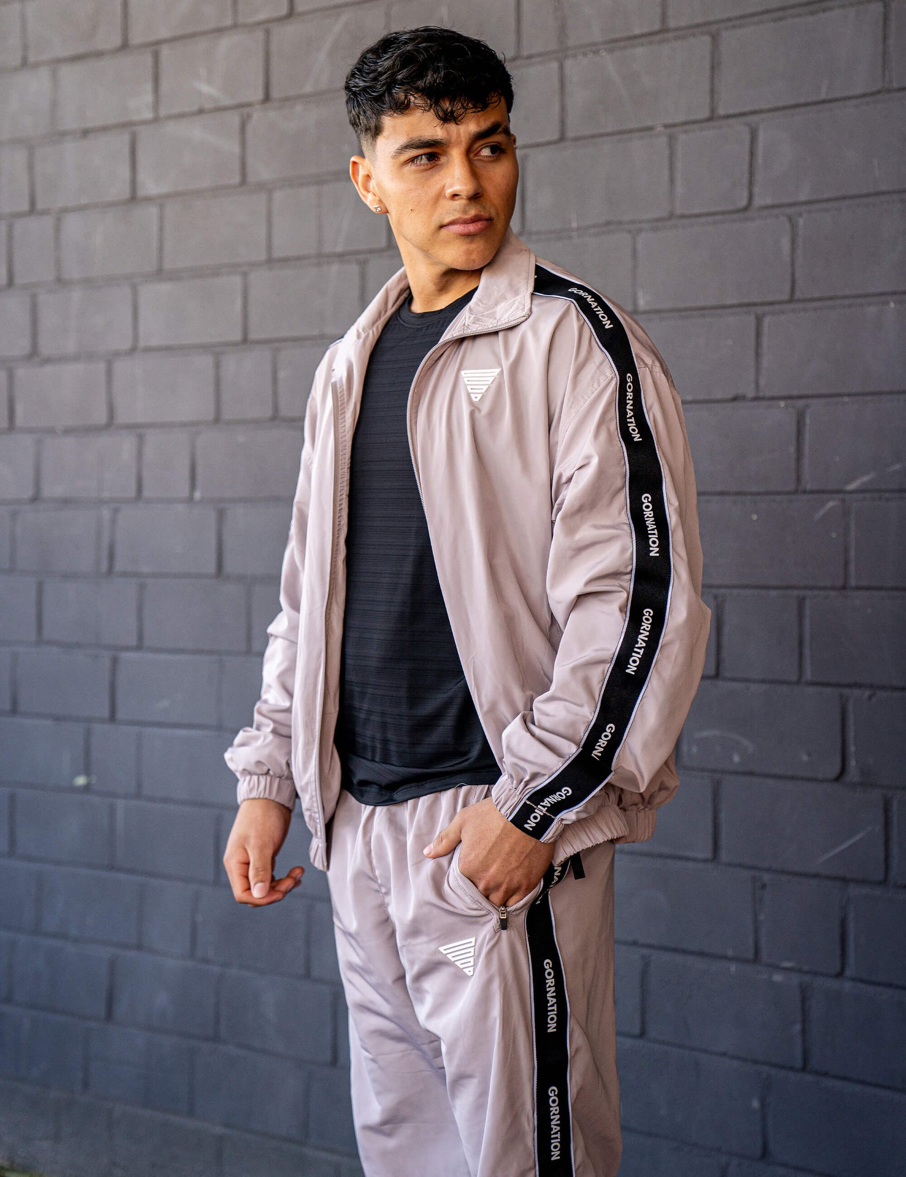 GORNATION athlete wearing the GORNATION tracksuite in grey