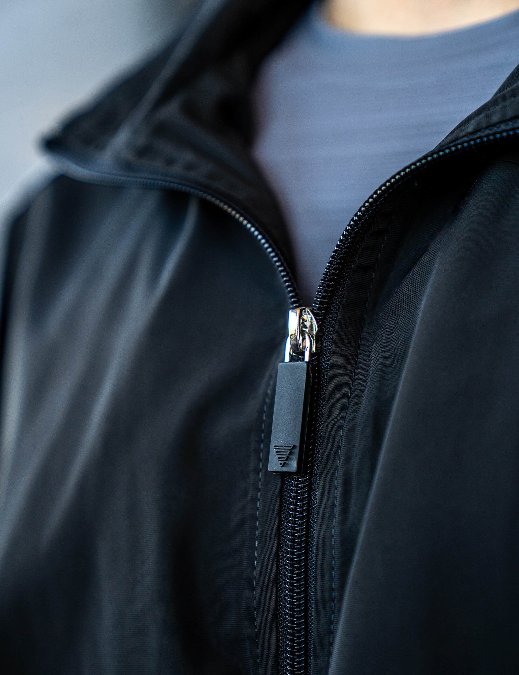 Close up of a GORNATION athlete wearing the GORNATION tracksuite jacket in black