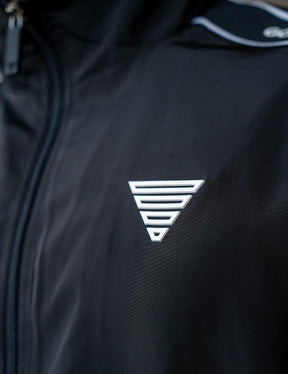 Close up of a GORNATION athlete wearing the GORNATION tracksuite jacket in black