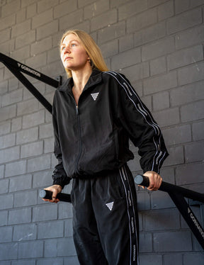 GORNATION athlete doing dips on GORNATION dip bars wearing a tracksuite