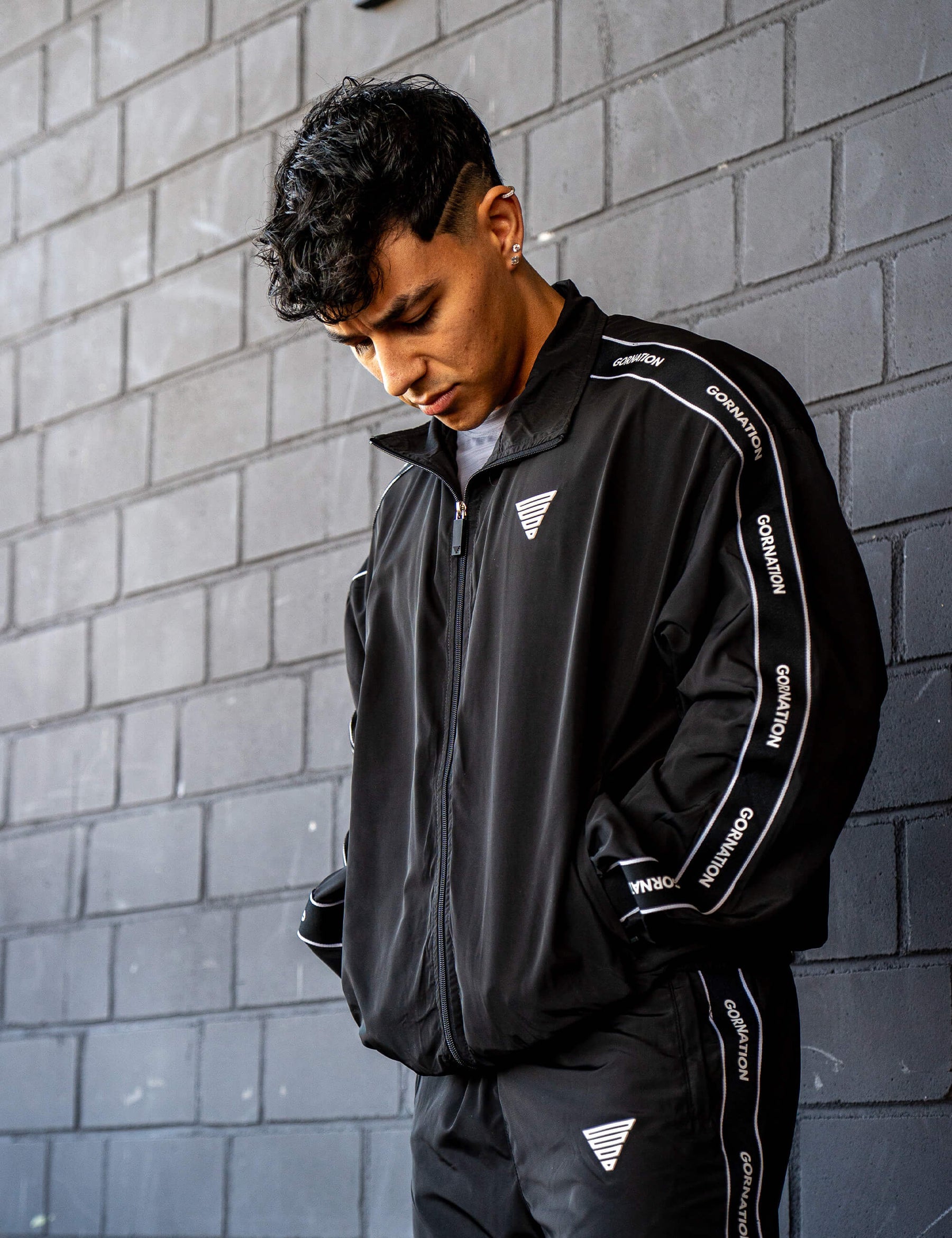 GORNATION athlete wearing the GORNATION tracksuite jacket in black