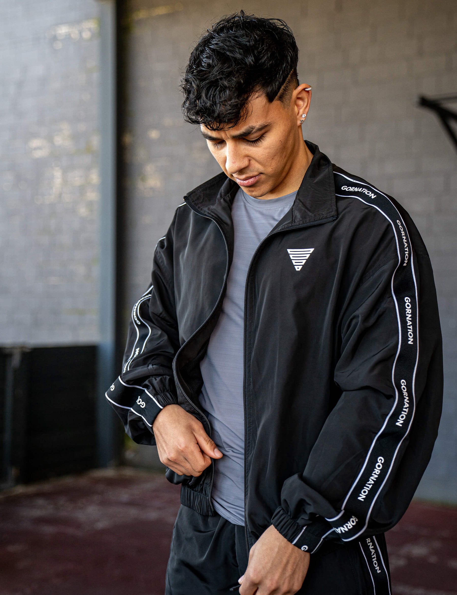 GORNATION athlete wearing the GORNATION tracksuite jacket in black