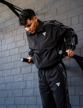 GORNATION athlete doing dips on GORNATION dip bars wearing a tracksuite