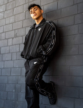 GORNATION athlete wearing the GORNATION tracksuite jacket in black