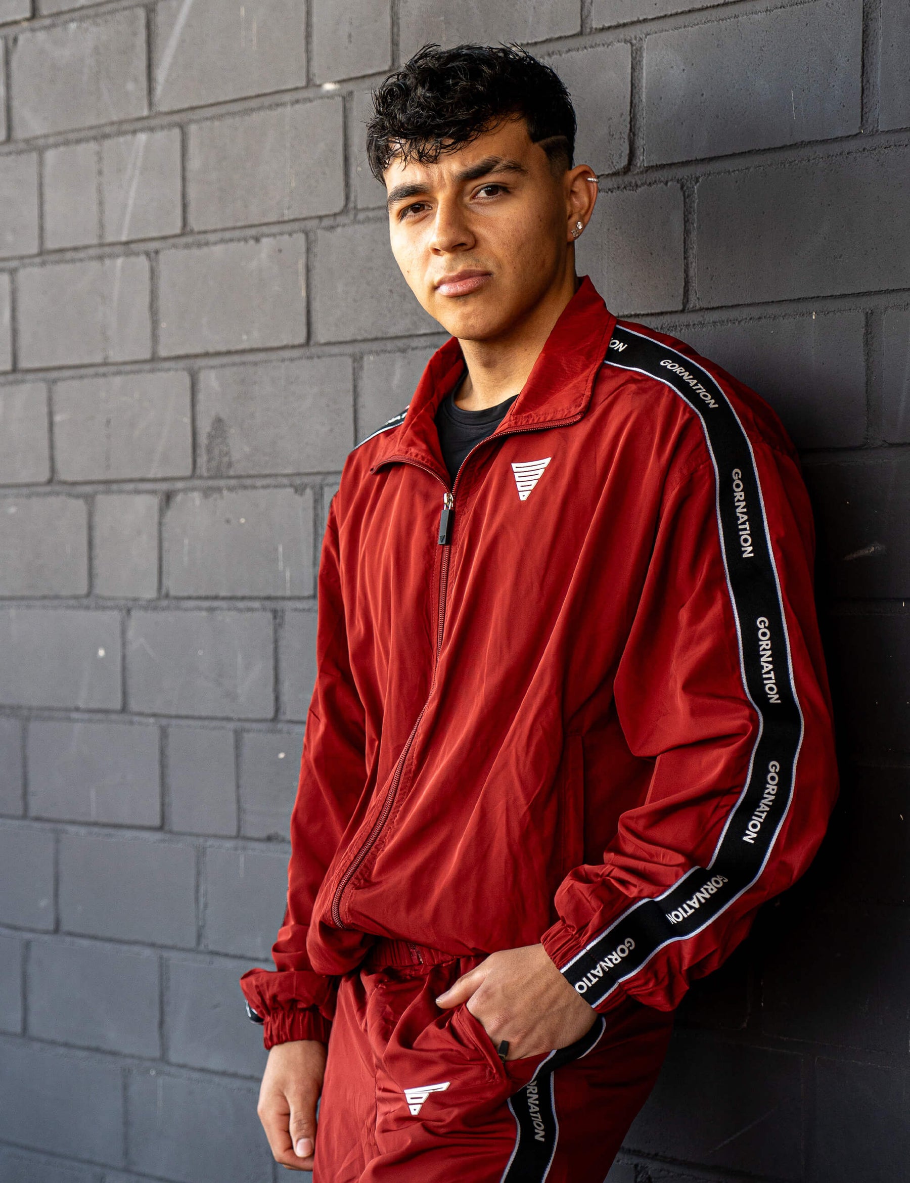 GORNATION athlete wearing the GORNATION tracksuite in red