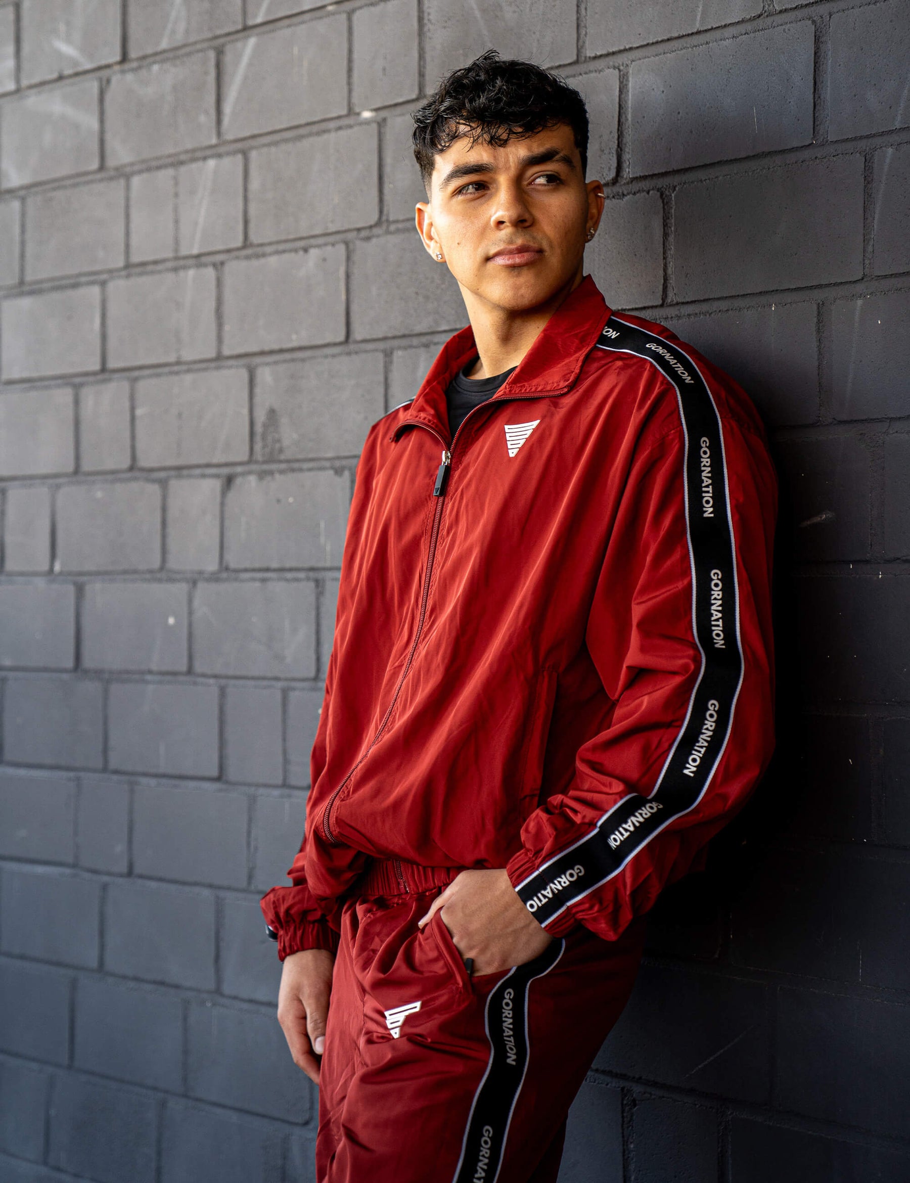 GORNATION athlete wearing the GORNATION tracksuite in red