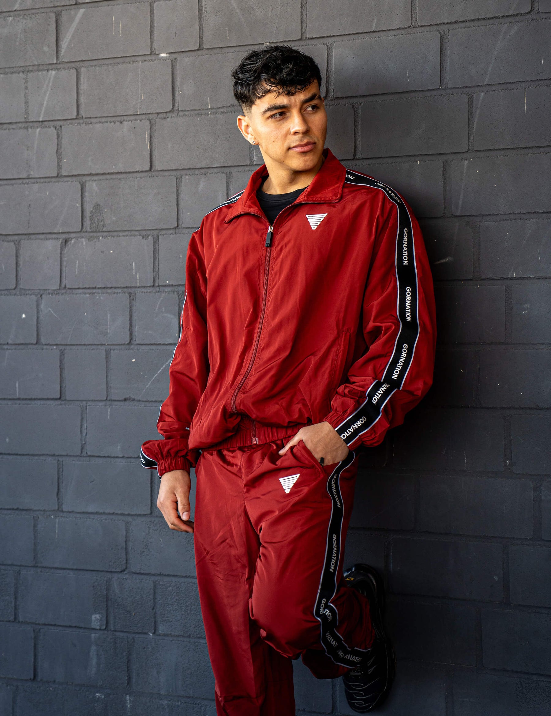 GORNATION athlete wearing the GORNATION tracksuite in red