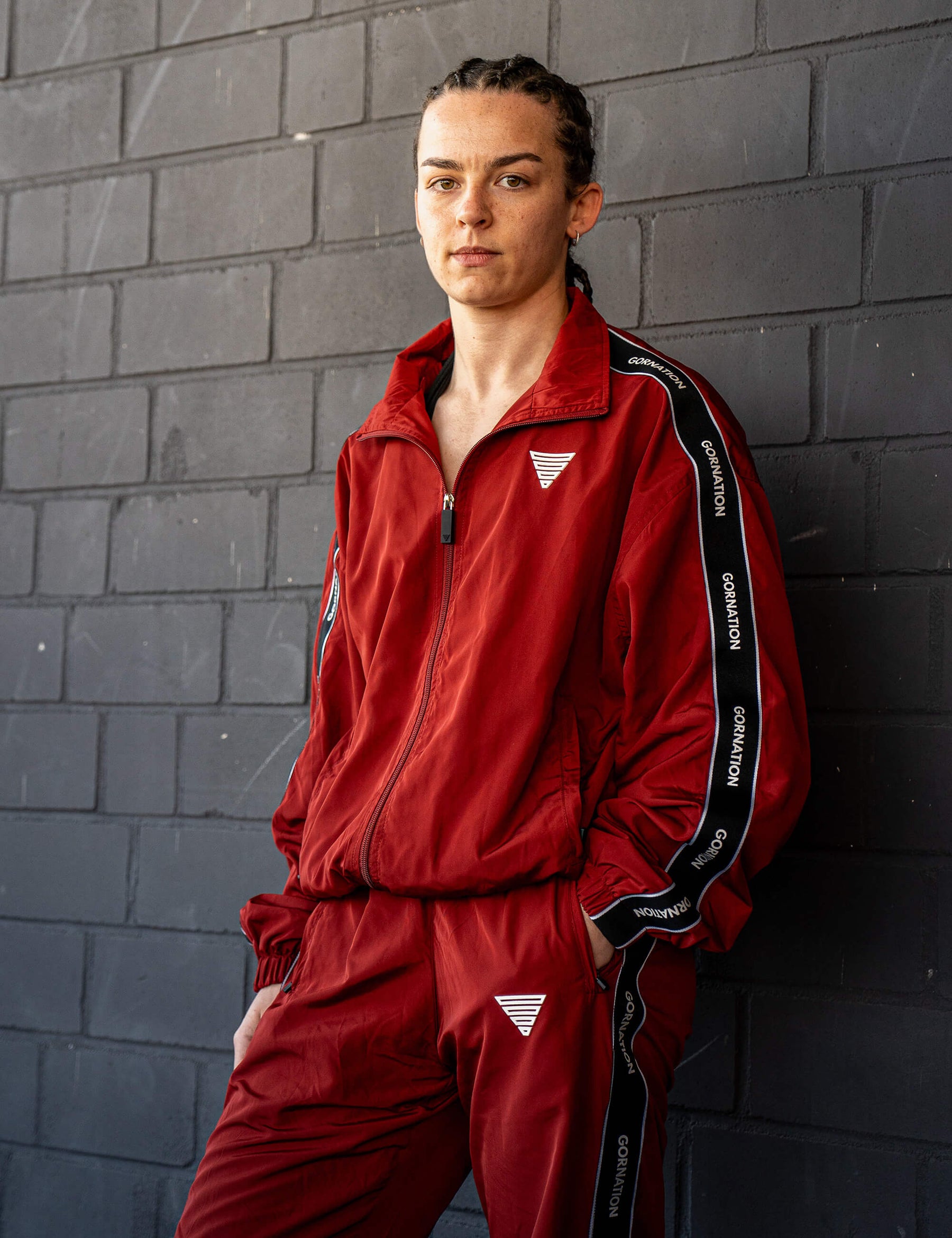 GORNATION athlete wearing the GORNATION tracksuite in red