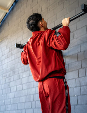 GORNATION athlete doing pull ups on a GORNATION pull up bar wearing a tracksuite