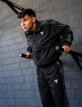 GORNATION athlete doing dips on GORNATION dip bars wearing a tracksuite