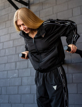 GORNATION athlete doing dips on GORNATION dip bars wearing a tracksuite