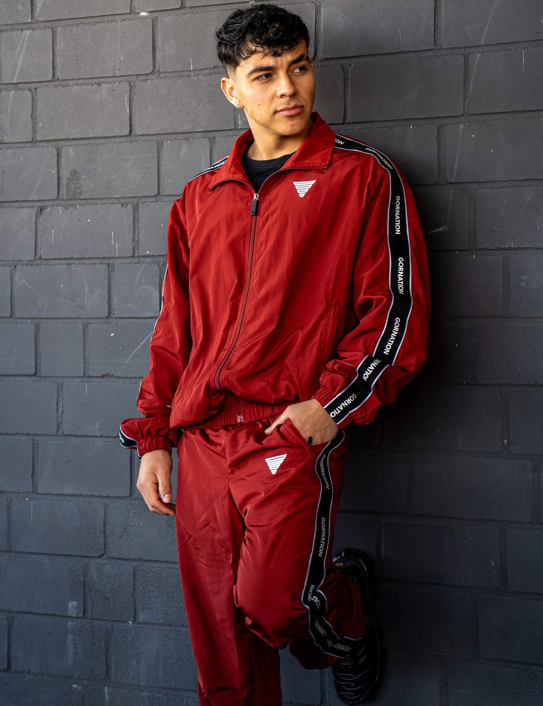 GORNATION athlete wearing the GORNATION tracksuite in red