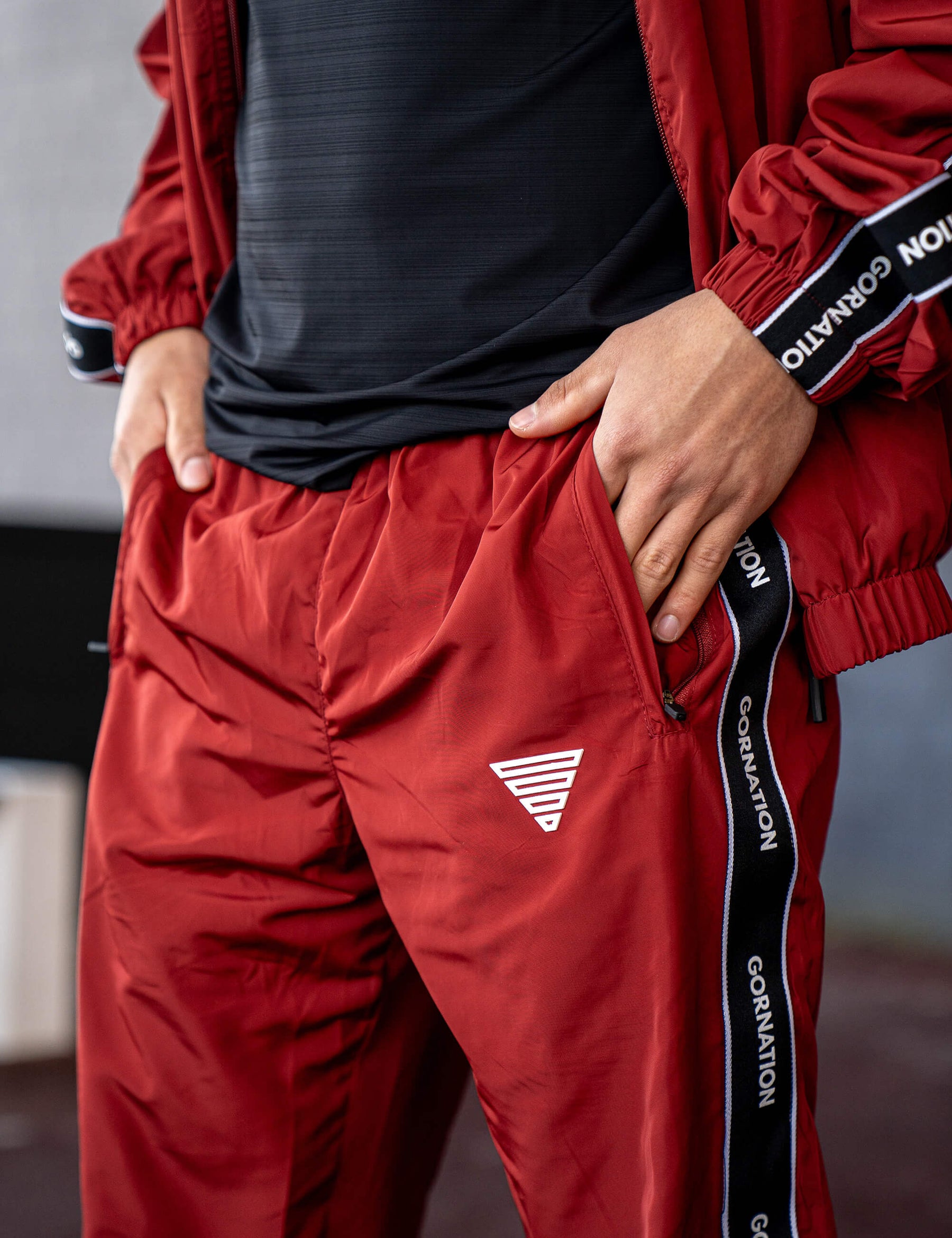 GORNATION athlete wearing the GORNATION tracksuite in red