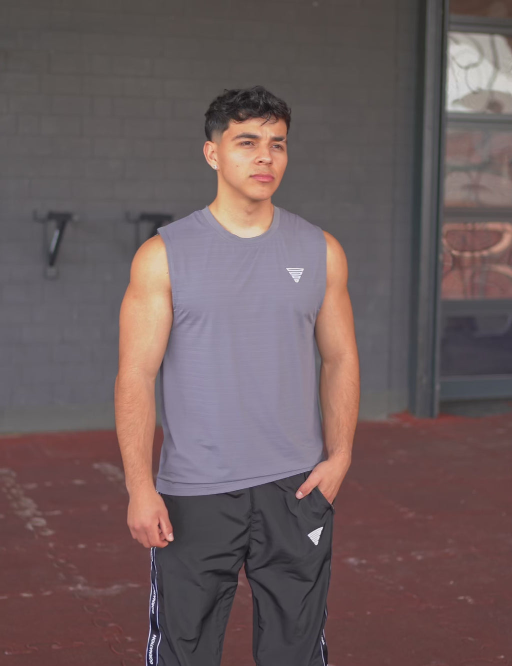GORNATION athlete wearing the GORNATION active tank top in grey